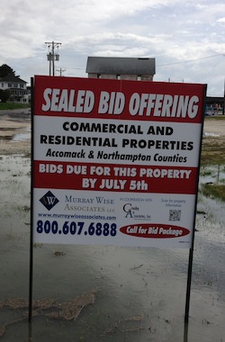 Brokerage sign for Madonia property for sale in Oyster. (Wave photo)