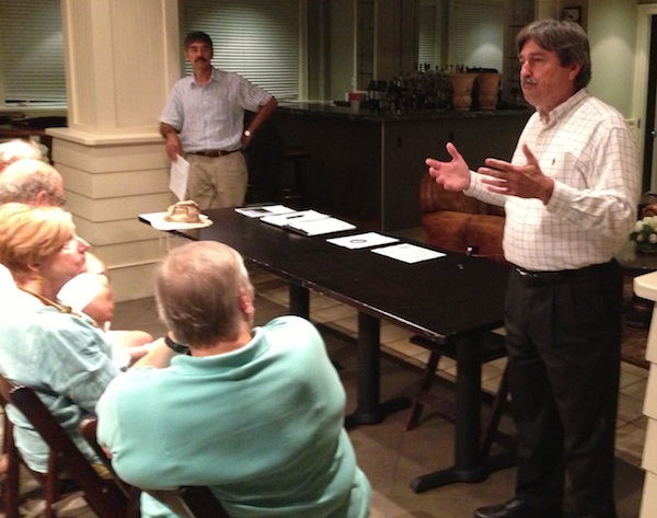 Economic Development Director Charles McSwain addresses Cape Charles Business Association September 11. Association president George Proto is at left. (Wave photo)