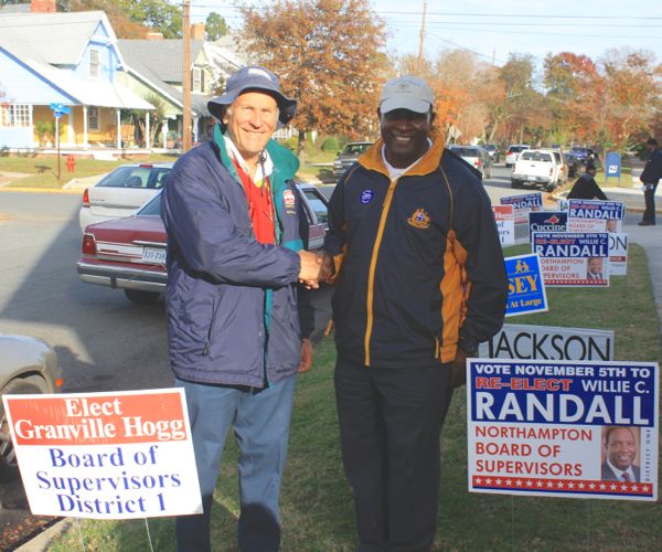 Candidates Hogg and Randall outside District 1 polling place Tuesday. The two are Butler's Bluff neighbors. (Wave photo)