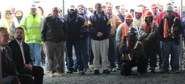Bayshore Concrete employees applaud announcement of 135 new jobs.
