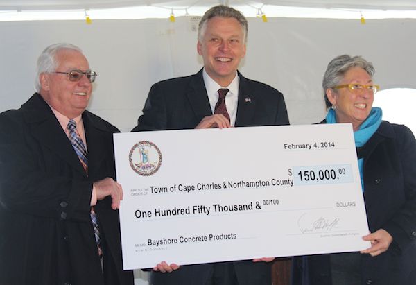 Gov. Terry McAuliffe presents check to Northampton County Board of Supervisors Chairman Larry LeMond and Cape Charles Mayor Dora Sullivan. The grant money goes to Bayshore Concrete Products in return for creating 135 jobs. (Wave photos)