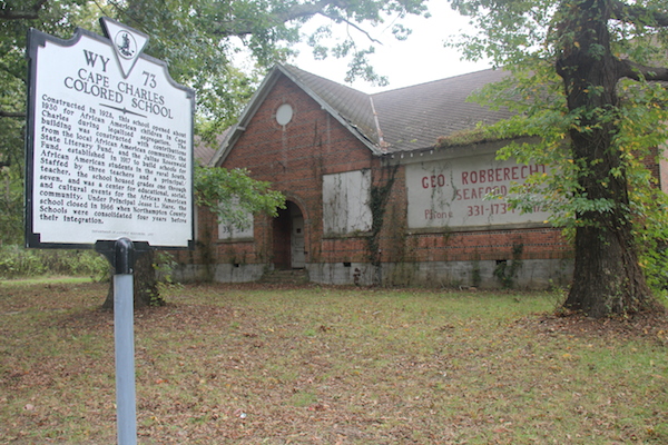Historic marker reads: Cape Charles Colored School  Constructed in 1928, this school opened about 1930 for African American children in Cape Charles during legalized segregation. The building was constructed with contributions from the local African American community, the State Literary Fund, and the Julius Rosenwald Fund, established in 1917 to build schools for African American students in the rural South. Staffed by three teachers and a principal/teacher, the school housed grades one through seven, and was a center for educational, social, and cultural events for the African American community. Under Principal Jesse L. Hare, the school closed in 1966 when Northampton County Schools were consolidated four years before their integration.