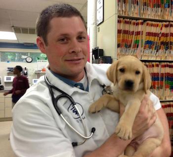 Dr. Nathan Higgins with a young patient.