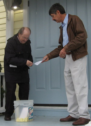 MAYER & MAYOR: Hank Mayer assists Mayer Proto in Thanksgiving Day golf cart raffle drawing.