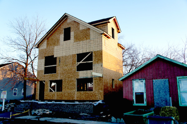 House under construction at 404 Jefferson Avenue towers over its boarded-up neighbor. The Historic District Review Board vetoed sliding glass doors on the front of the house. (Wave photo)
