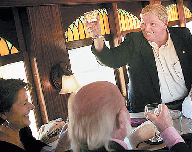 Bay Creek developer Richard "Dickie" Foster toasts Oral and Mrs. Lamber during happier times in 2008. (Photo: Virginian-Pilot)