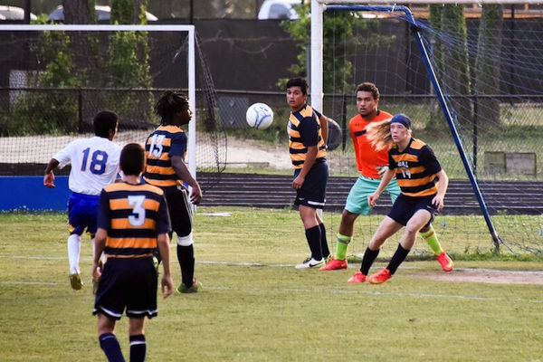 Number 18 Elian Morales fires a shot at the W&L goal. (Photo: Chris Glennon)